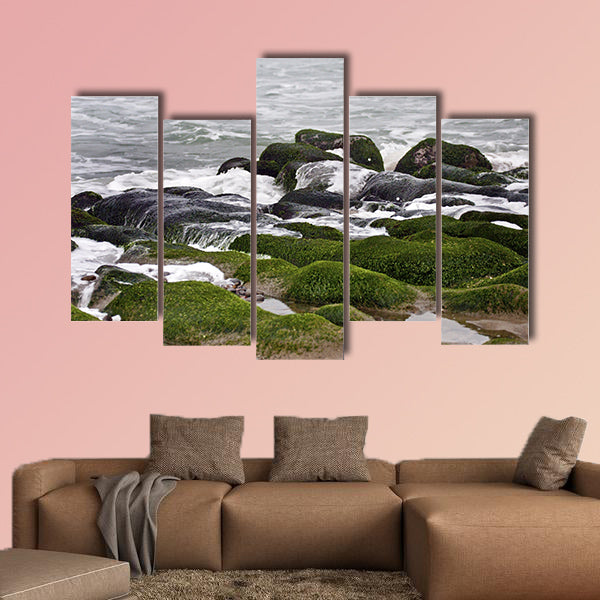 Stunning view of surf on green rock multi panel canvas wall art