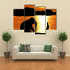 Elephant Training in Thailand During Sunset Silhouetted Multi Panel Canvas Wall Art