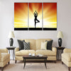 healthy woman practice yoga at beach during sunset silhouetted board Multi panel canvas wall art