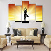 healthy woman practice yoga at beach during sunset silhouetted board Multi panel canvas wall art