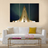 Northern lights shining over the church multi panel canvas wall art