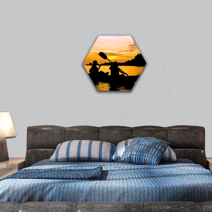Silhouette of Two person kayaking in the sea at sunset hexagonal canvas wall art
