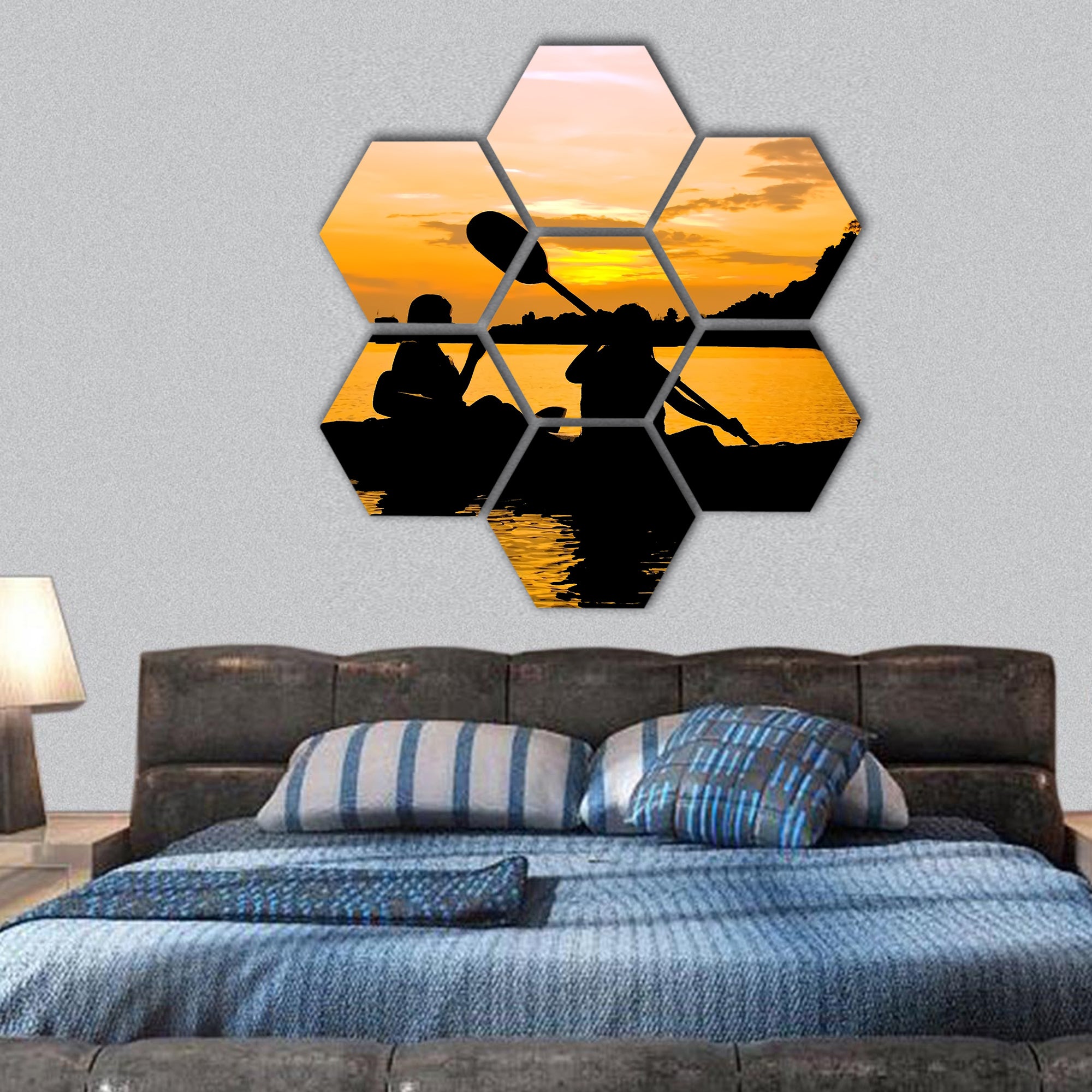 Silhouette of Two person kayaking in the sea at sunset hexagonal canvas wall art