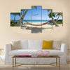 Exotic travel composition with a flying plane, a tropical beach Multi panel canvas wall art