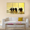 Soldiers run in army uniform Multi Panel Canvas Wall Art