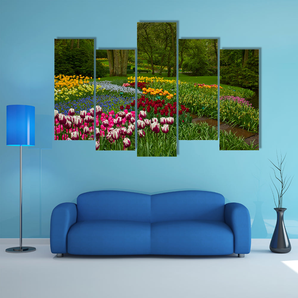 Colorful spring flowers and blossom in dutch garden Keukenhof , Holland multi panel canvas wall art