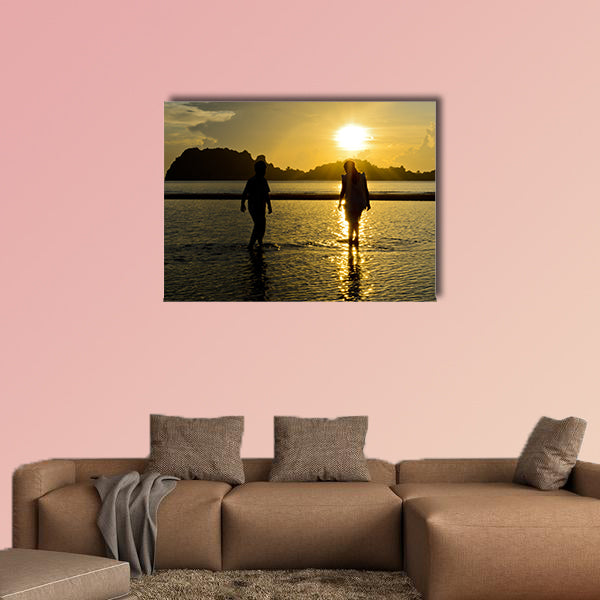 Boys and girls playing on the beach at sunrise Multi panel canvas wall art