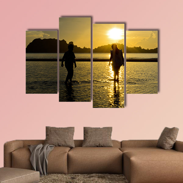 Boys and girls playing on the beach at sunrise Multi panel canvas wall art