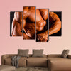 Muscular man top body studio shot Multi panel canvas wall art