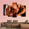 Muscular man top body studio shot Multi panel canvas wall art