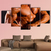 Muscular man top body studio shot Multi panel canvas wall art