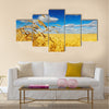 Ripe wheat ears over wheat field Multi panel canvas wall art