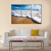 Waves wash over golden sand on Australian beach Multi Panel Canvas Wall Art