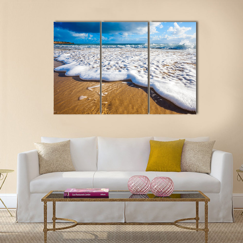 Waves wash over golden sand on Australian beach Multi Panel Canvas Wall Art