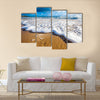 Waves wash over golden sand on Australian beach Multi Panel Canvas Wall Art