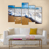 Waves wash over golden sand on Australian beach Multi Panel Canvas Wall Art