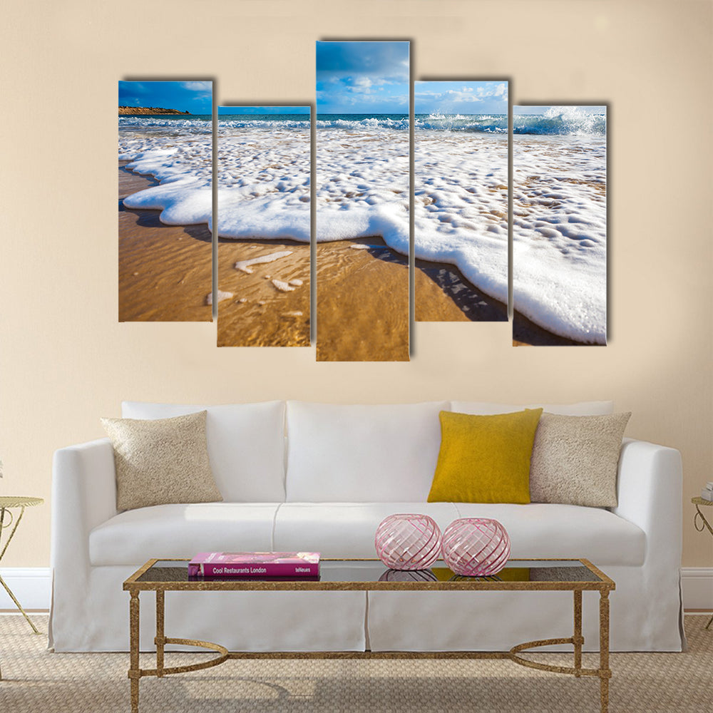 Waves wash over golden sand on Australian beach Multi Panel Canvas Wall Art