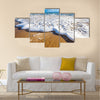 Waves wash over golden sand on Australian beach Multi Panel Canvas Wall Art