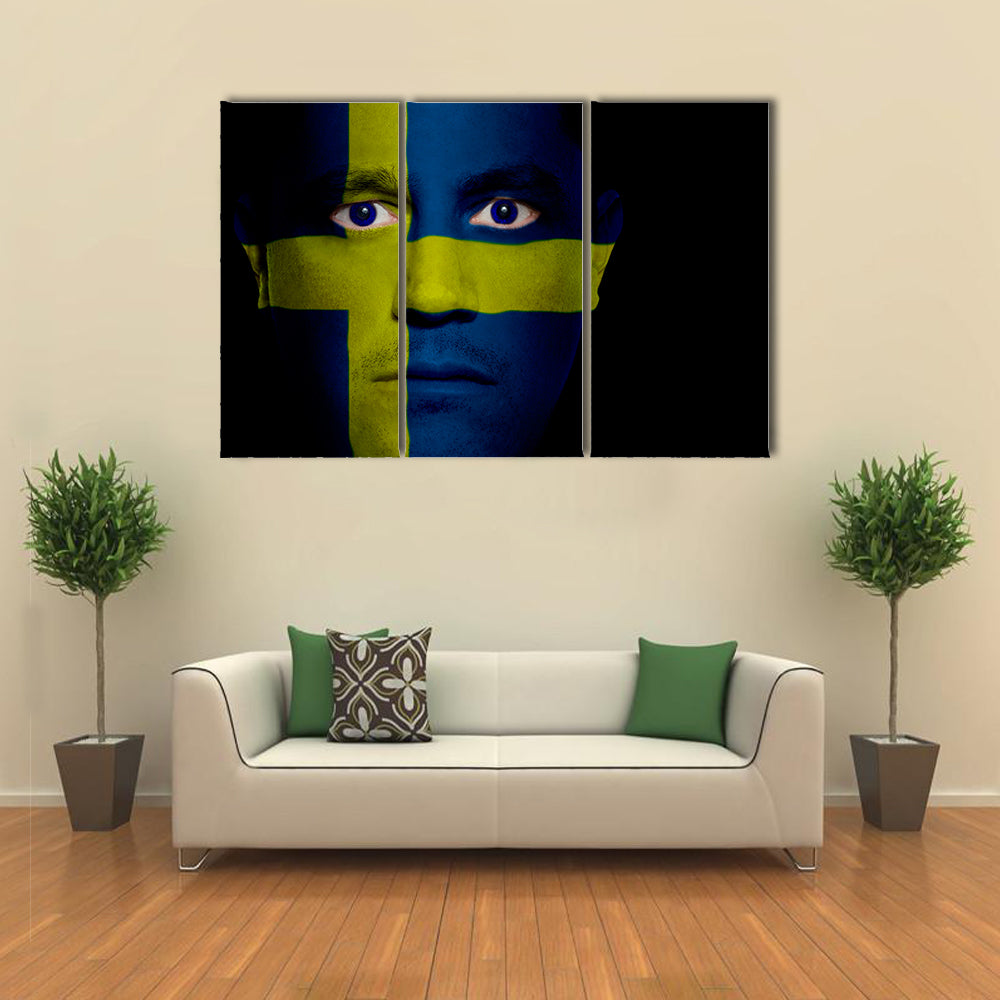 Swedish Flag Painted Onto A Man's Face Multi Panel Canvas Wall Art