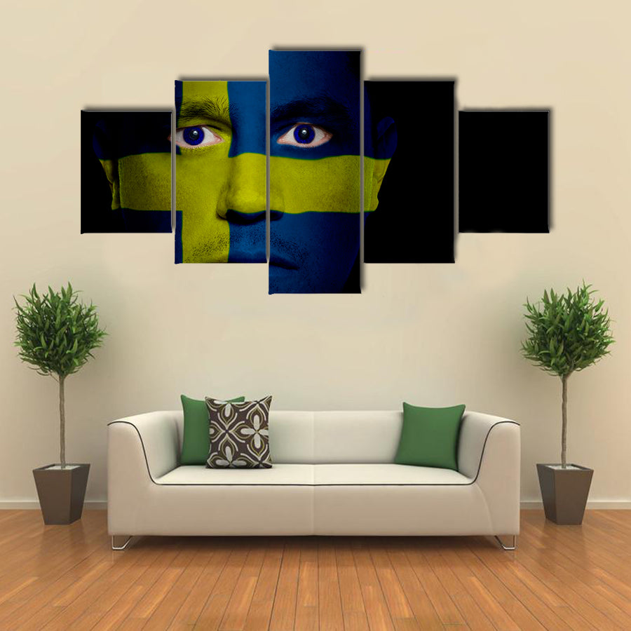 Swedish Flag Painted Onto A Man's Face Multi Panel Canvas Wall Art