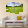 Green field for golf near hotel Multi Panel Canvas Wall Art