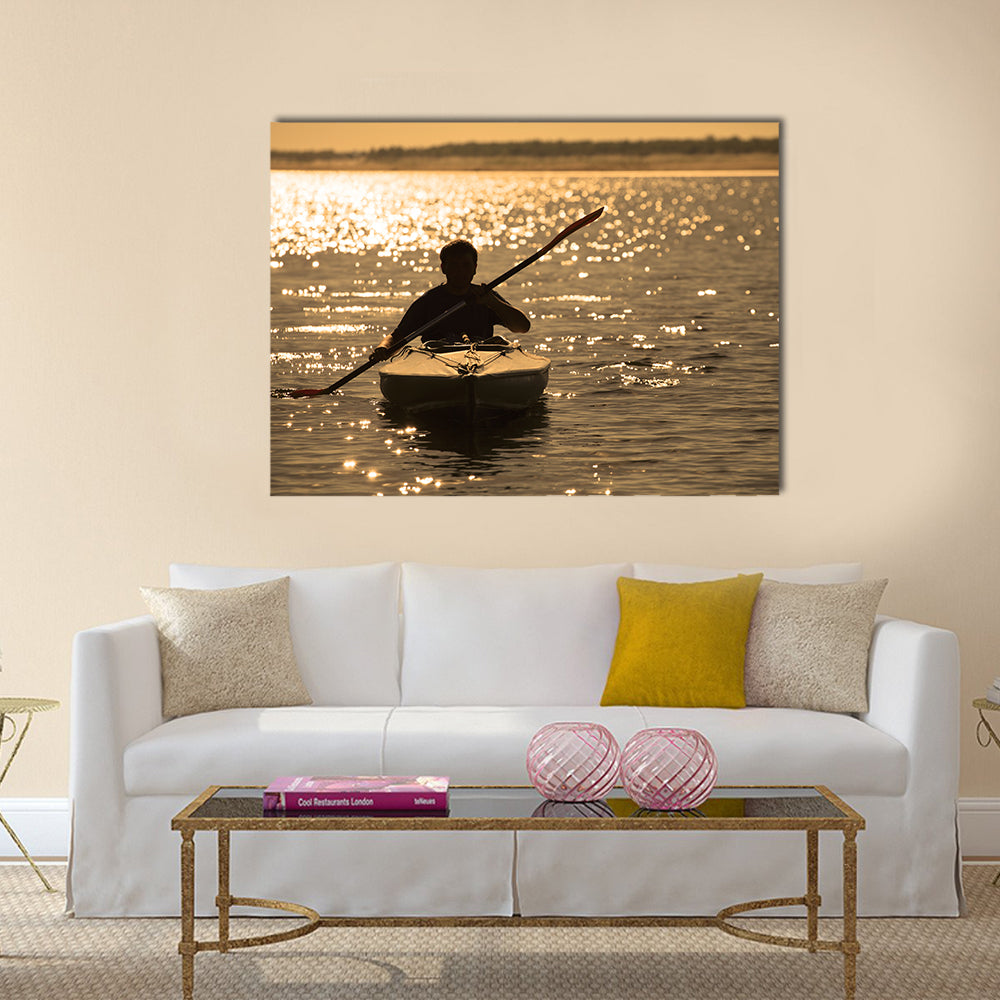 Silhouette of a man rowing in the canoe Multi panel canvas wall art