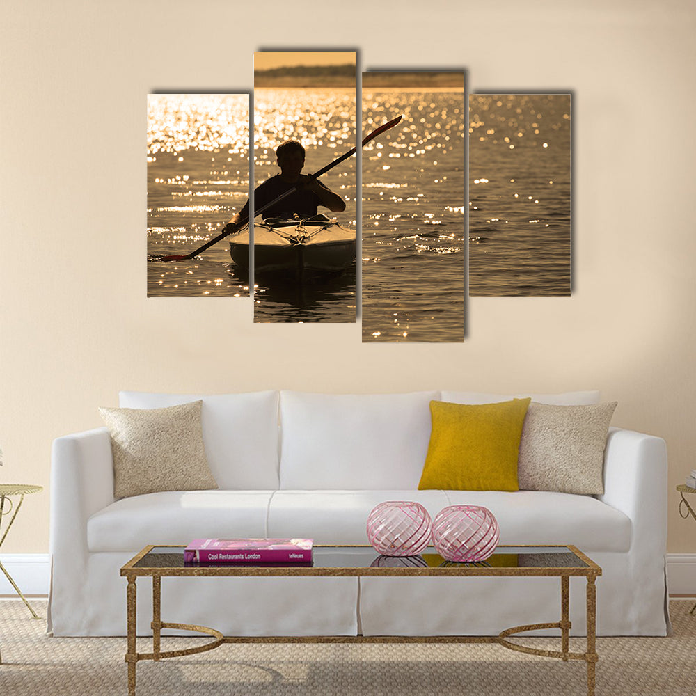 Silhouette of a man rowing in the canoe Multi panel canvas wall art