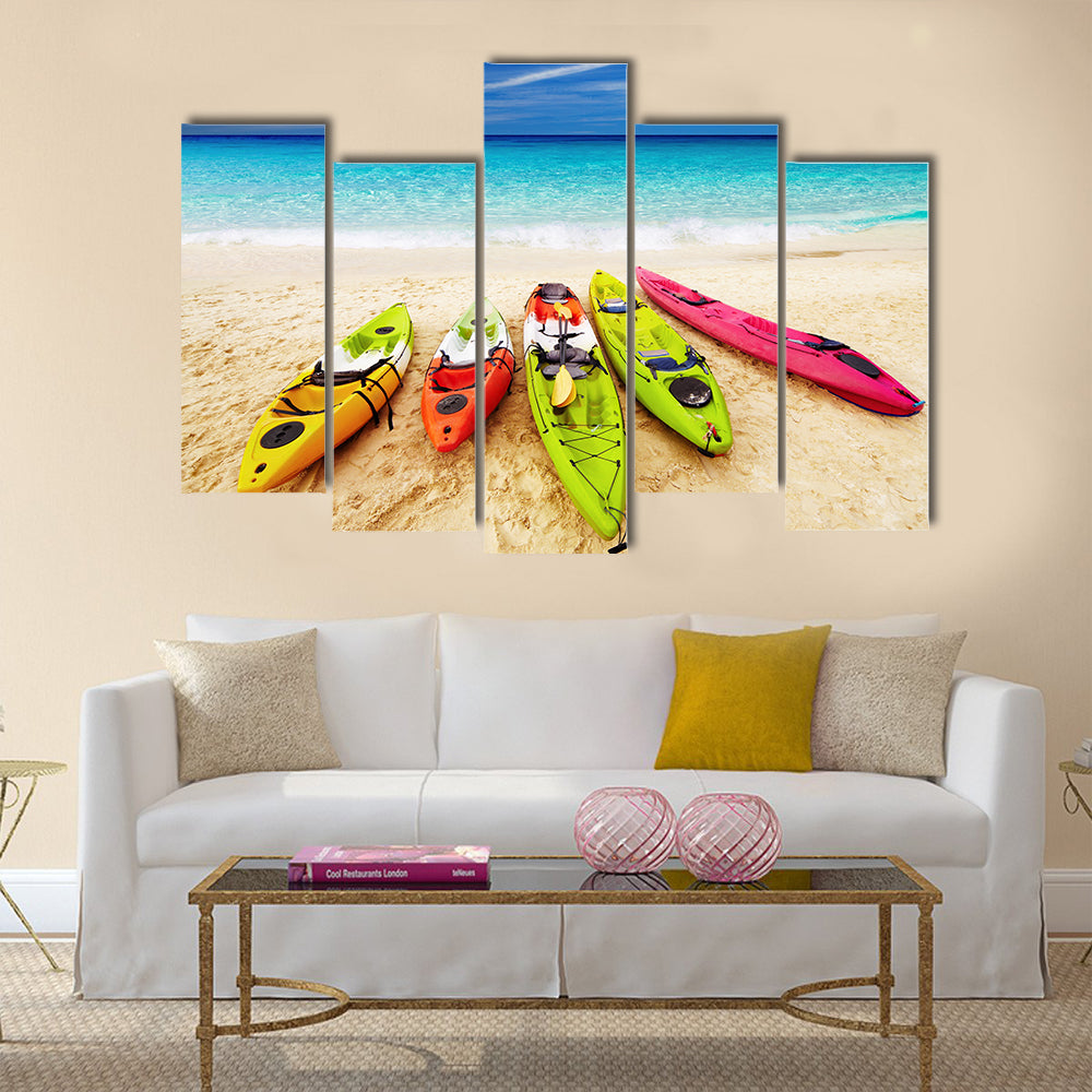 Colorful kayaks on the tropical beach Multi panel canvas wall art