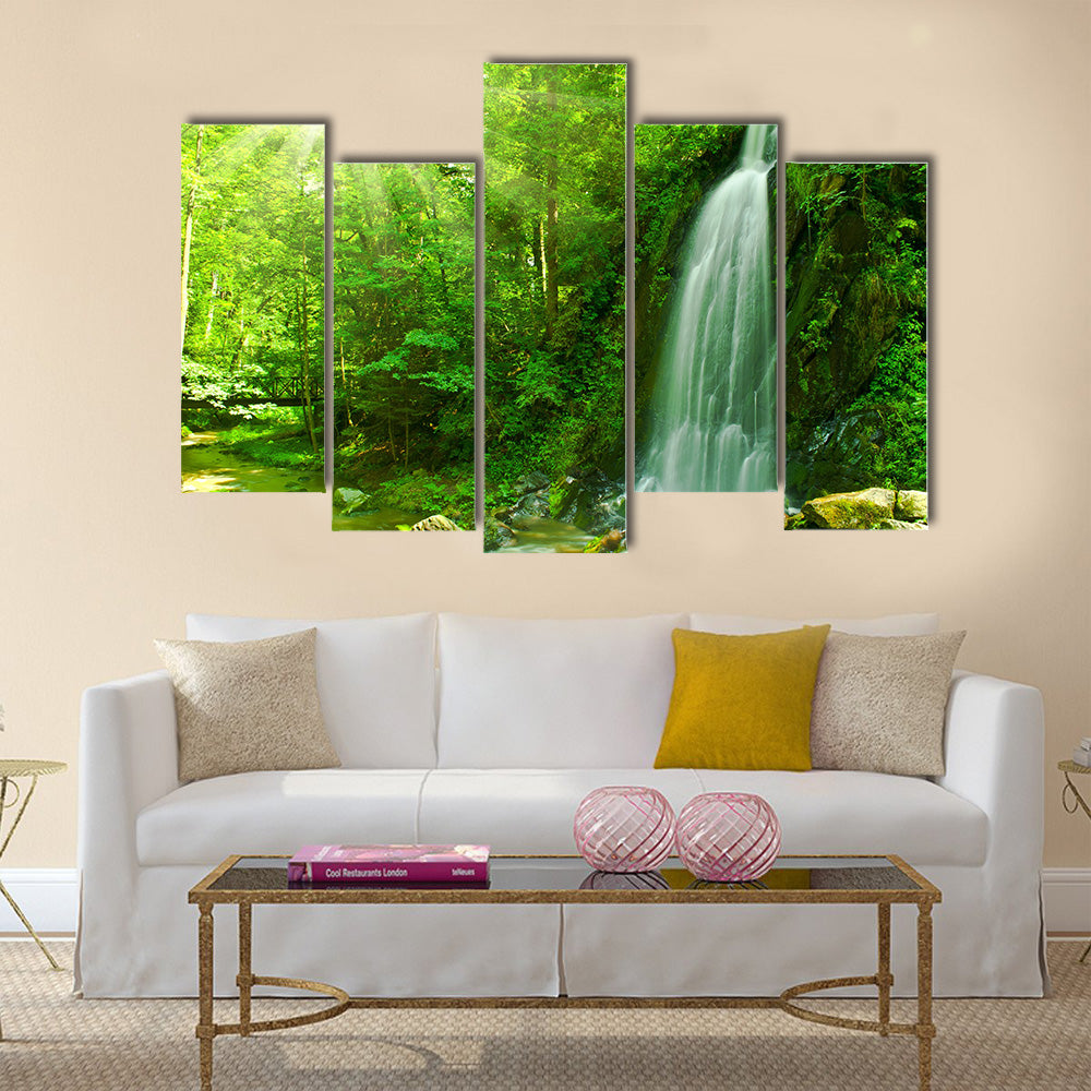 Nice waterfall through green forest Multi Panel Canvas Wall Art
