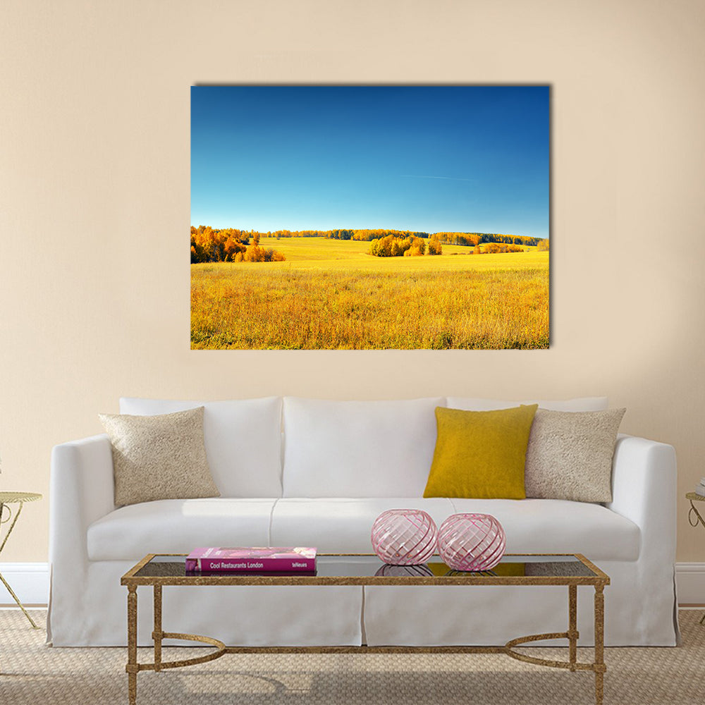 Autumn landscape. Yellow field and blue sky Multi panel canvas wall art