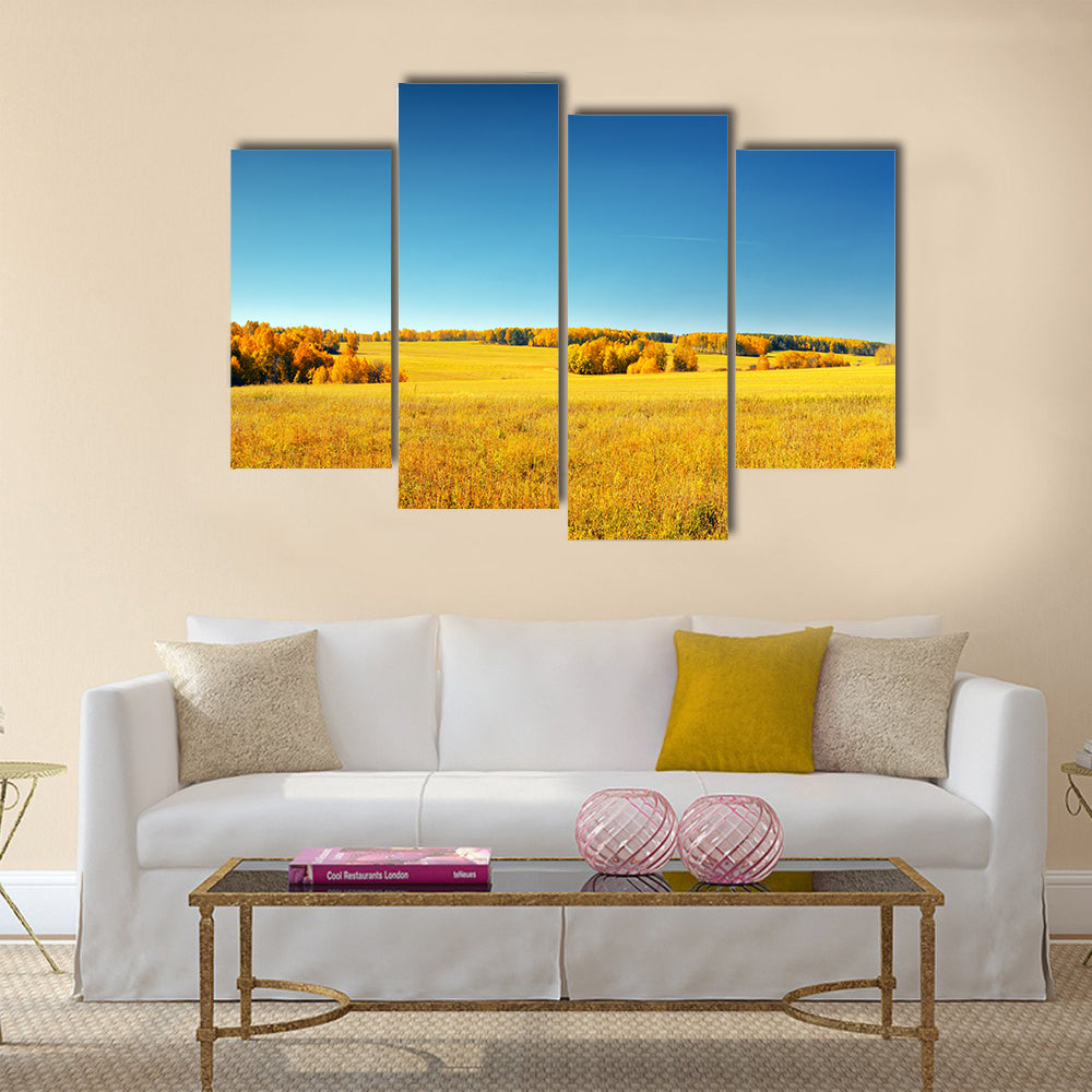Autumn landscape. Yellow field and blue sky Multi panel canvas wall art