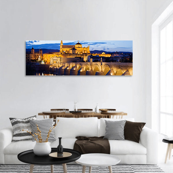 Roman Bridge on Guadalquivir river ,Great Mosqueat twilight panoramic canvas wall art