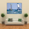 Back view of two windsurfers in action moving parallel to eath other Multi panel canvas wall art