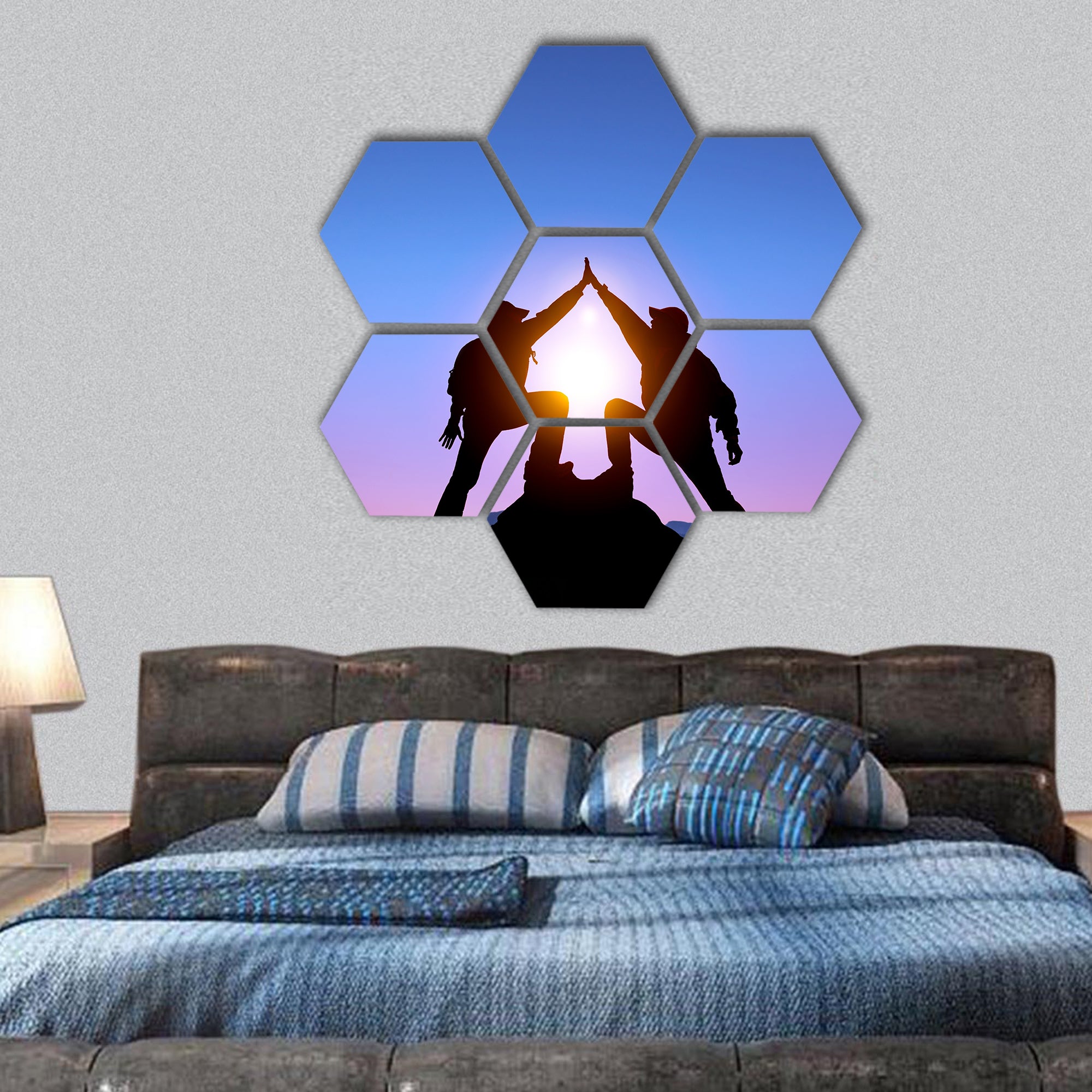 Silhouette of two man on the top of mountain hexagonal canvas wall art
