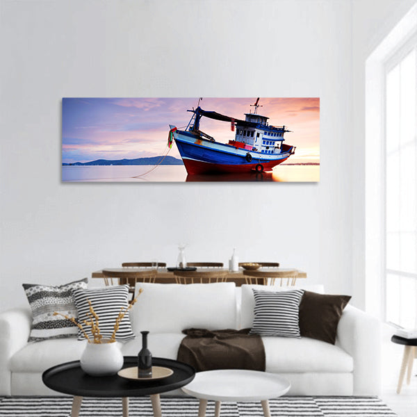Thai fishing boat as a vehicle for finding fish in sea at sunset panoramic canvas wall art