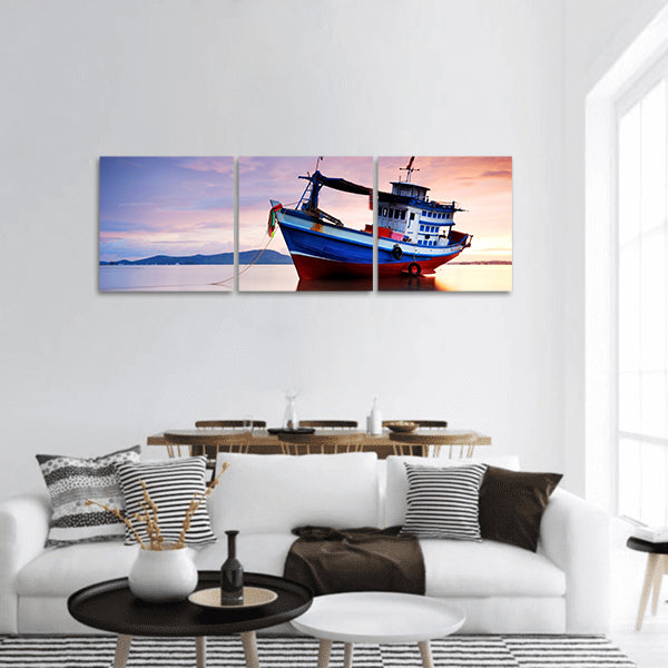 Thai fishing boat as a vehicle for finding fish in sea at sunset panoramic canvas wall art