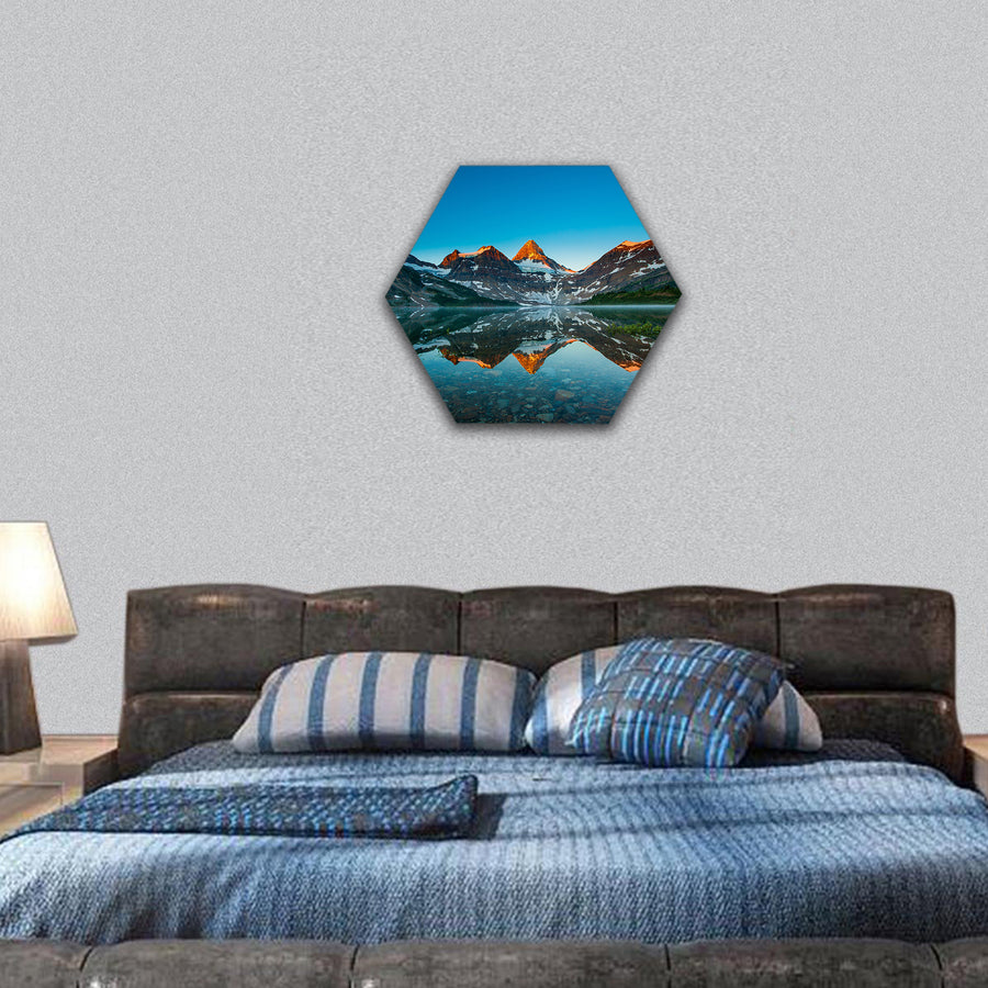 Reflection of mount Assiniboine on Magog lake at sunrise, Alberta, Canada hexagonal canvas wall art