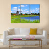 Traditional Dutch windmills along a canal near Alkmaar, Netherlands Multi panel canvas wall art