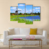 Traditional Dutch windmills along a canal near Alkmaar, Netherlands Multi panel canvas wall art