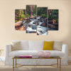 Dreamy mountain stream flowing through forest between boulders Multi Panel Canvas Wall Art