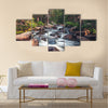 Dreamy mountain stream flowing through forest between boulders Multi Panel Canvas Wall Art