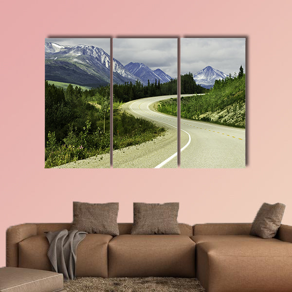 Curved asphalt road in high mountains of Alaska multi panel canvas wall art