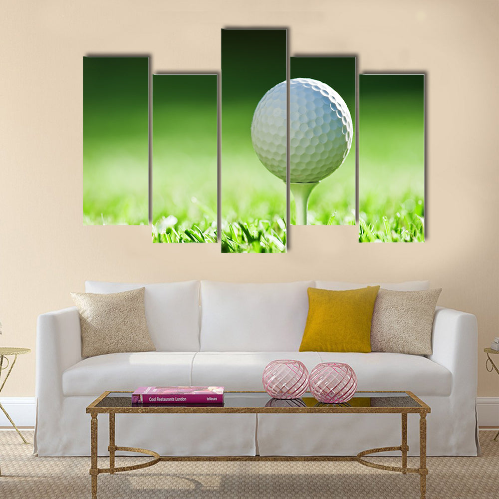 Golf ball on green grass Multi Panel Canvas Wall Art