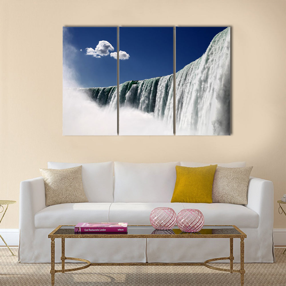 horse shoe falls on the blue background. Niagara Falls Canada multi panel canvas wall art