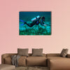 Spear fisherman with spear gun Multi panel canvas wall art