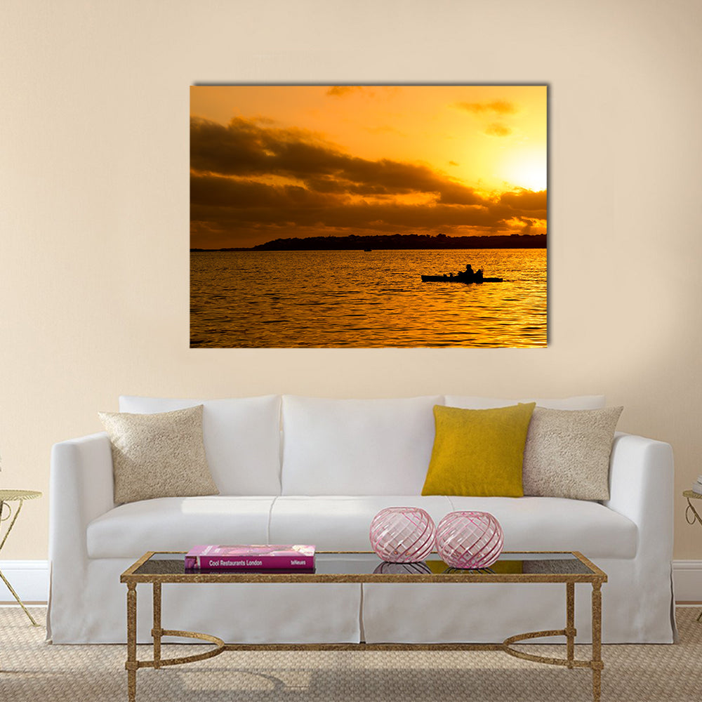 Fisherman silhouette in kayak Multi panel canvas wall art