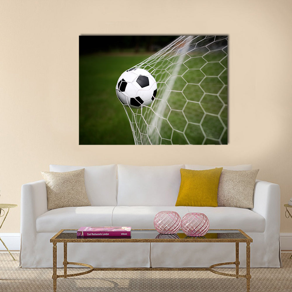 Soccer ball in goal Multi panel canvas wall art