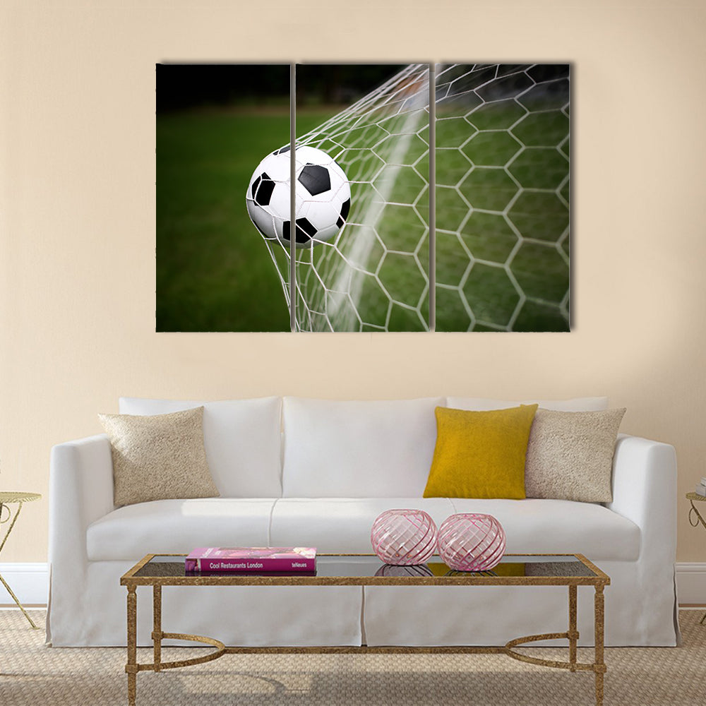 Soccer ball in goal Multi panel canvas wall art