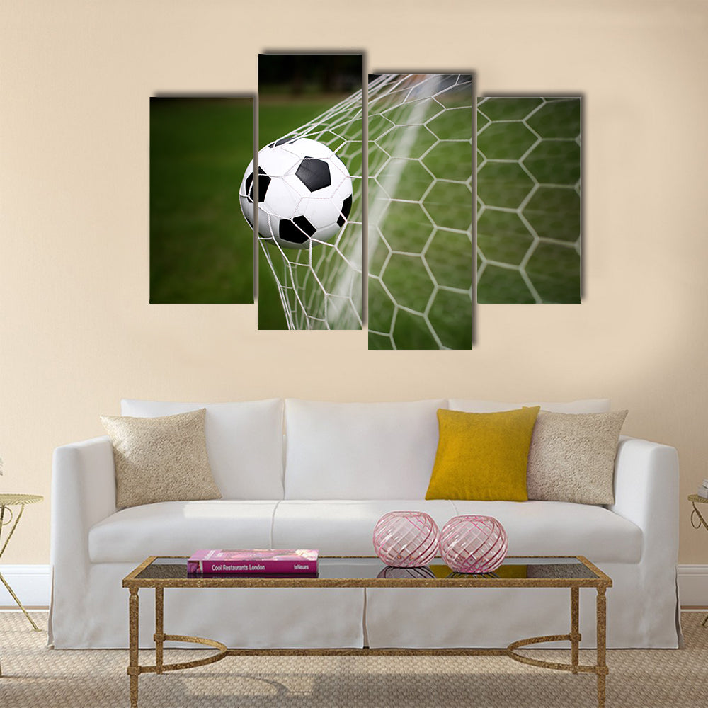Soccer ball in goal Multi panel canvas wall art
