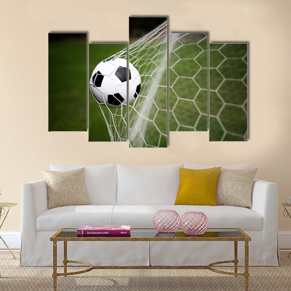 Soccer ball in goal Multi panel canvas wall art